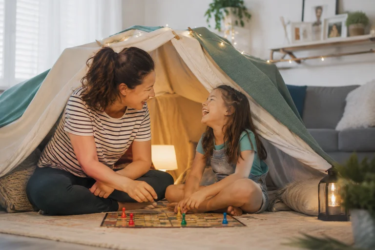 Parent and child enjoying a free at-home activity together in a bright living room